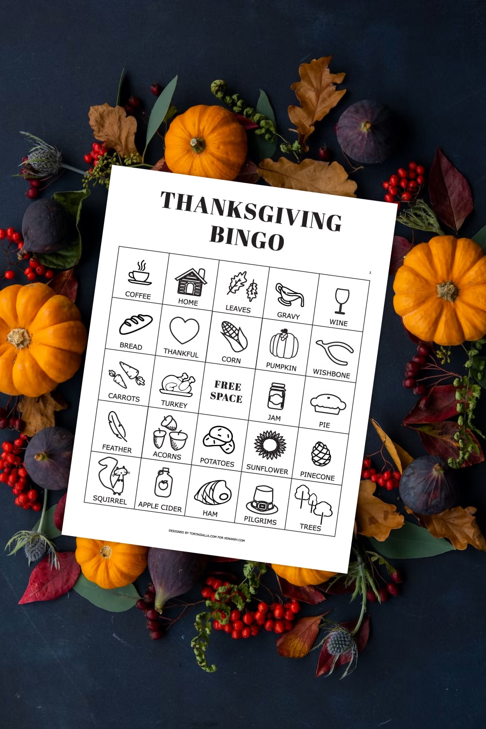 Preview of printable bingo pages with Thanksgiving icons on top of a dark background with a circular wreath made of pumpkins, figs and various leaves and berries.
