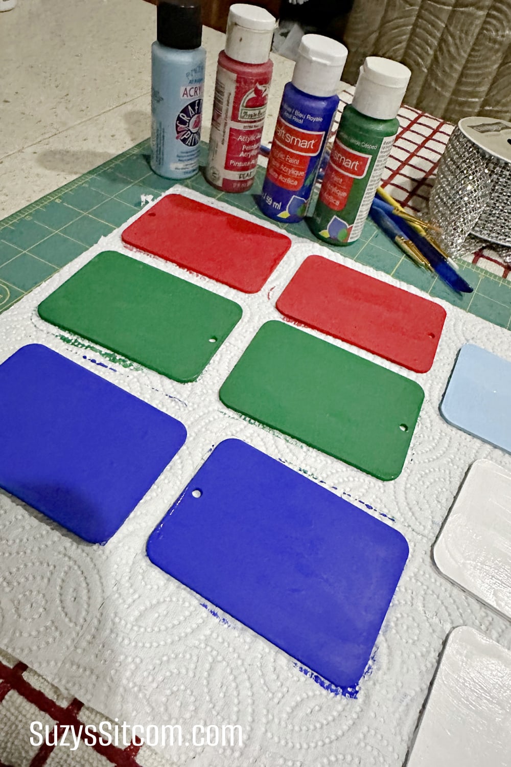 Paint the base color on each wooden tag