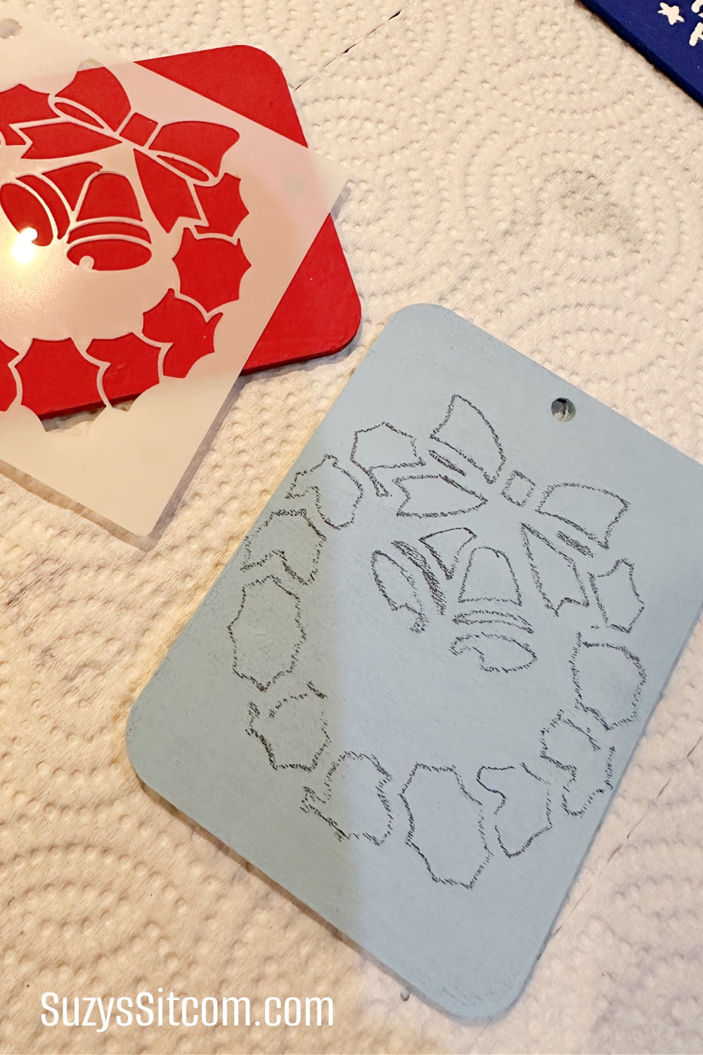 The traced design on the wooden gift tag.