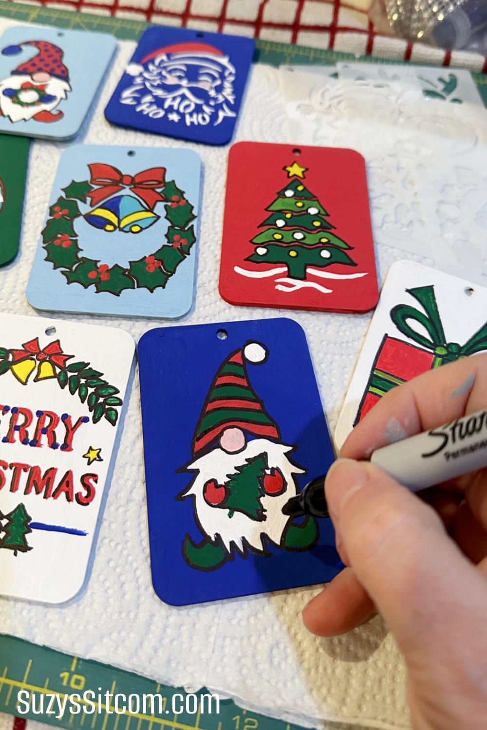 Painting the gift tags and outlining with a sharpie pen.