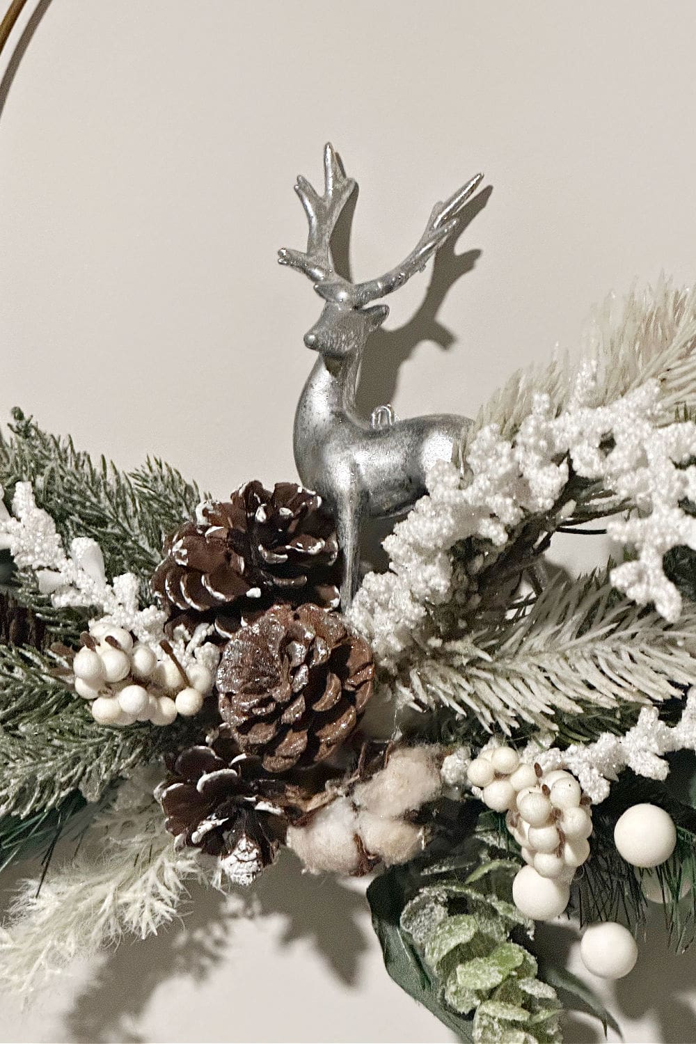 close up of winter wreath with deer