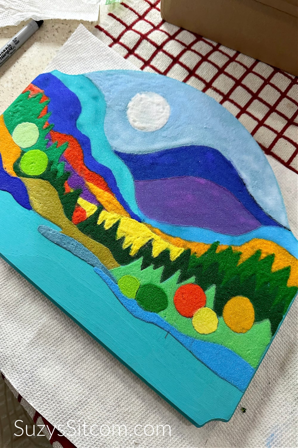Landscape art with all colors of sand added.