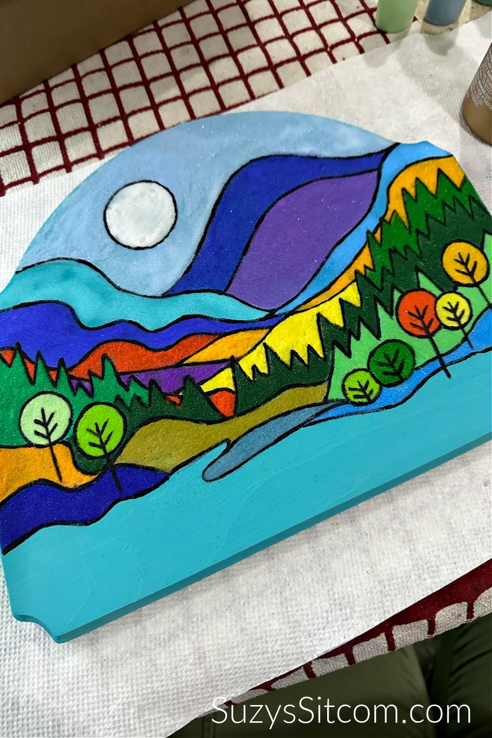 Sand Painting; Landscape art using colored sand.