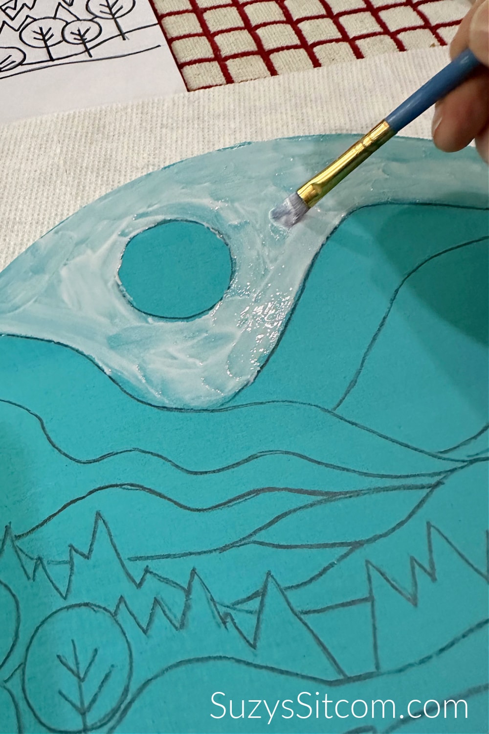 Add a layer of glue to a small area.