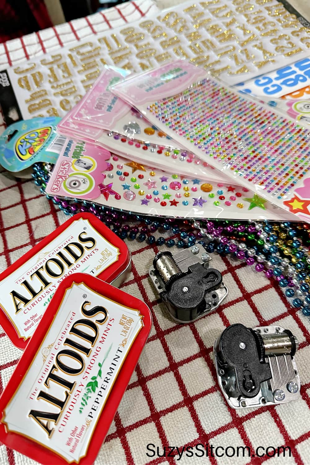 Supplies need to make music boxes with Altoid tins.