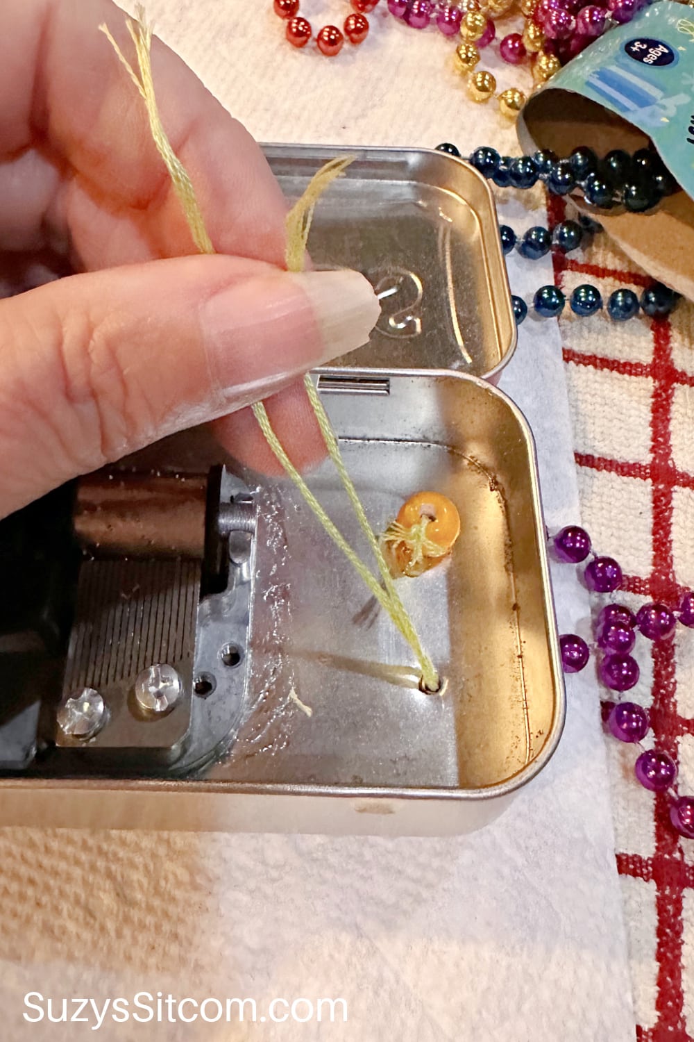 Adding beads to music box