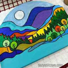 Mountain landscape painted with colored sand