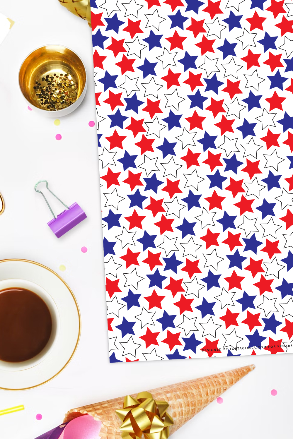 Preview of red white and blue stars patterned page printable on white  background with variety of decorations strewn about from gold glitter in a bowl on the top left, purple bull dog flip on the left middle, cup of coffee on lower left and ice cream cone with bow on the bottom. 